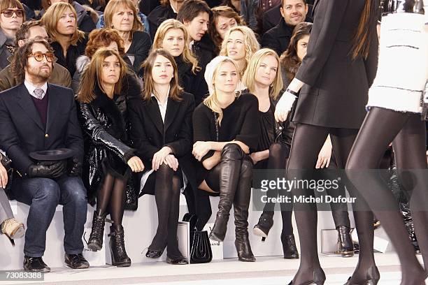 Model walks on the catwalk next to Sean Lennon, Karine Roitfeld, Sofia Coppola, Diane Kruger and Kate Bosworth at the Chanel Fashion show, during...