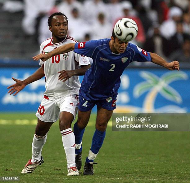 Abu Dhabi, UNITED ARAB EMIRATES: Kuwaiti Yaqoub Nasser Abdullah vies with Emirati player Ismail Matar during their 18th Gulf Cup Championship...