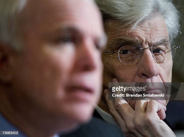 Sen. John Warner listens to U.S. Sen. John McCain during a hearing of the Senate Armed Services Committee on Capitol Hill January 23, 2007 in...