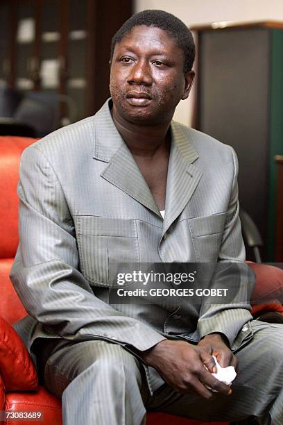 Captain Ousmane Conte, son of Guinean President Lansana Conte, listens to journalists's questions during a press conference at the Information...