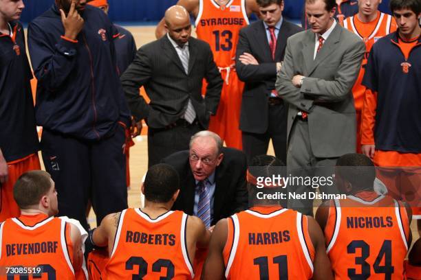 Head coach Jim Boeheim of the Syracuse University Orange speaks with players on the bench against the St. John's University Red Storm at Madison...
