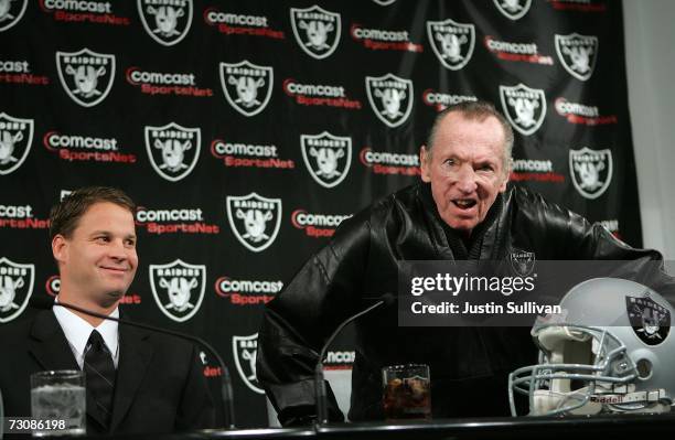 Newly hired head coach of the Oakland Raiders, Lane Kiffin , smiles as Raiders owner Al Davis reacts to a question during a press conference on...