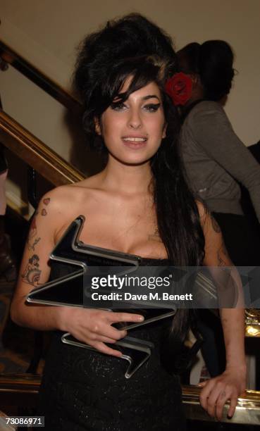 Singer Amy Whinehouse poses with the Pop award for Back to Black at the South Bank Show Awards, held at The Savoy Hotel January 23, 2007 in London,...