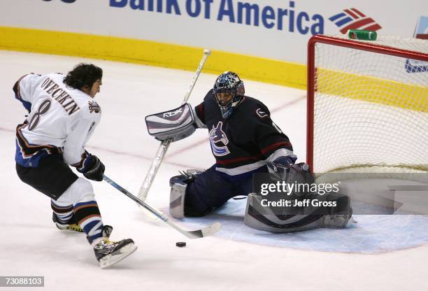 Eastern Conference All-Star Alex Ovechkin of the Washington Capitals scores a goal against Western Conference All-Star goaltender Roberto Luongo of...