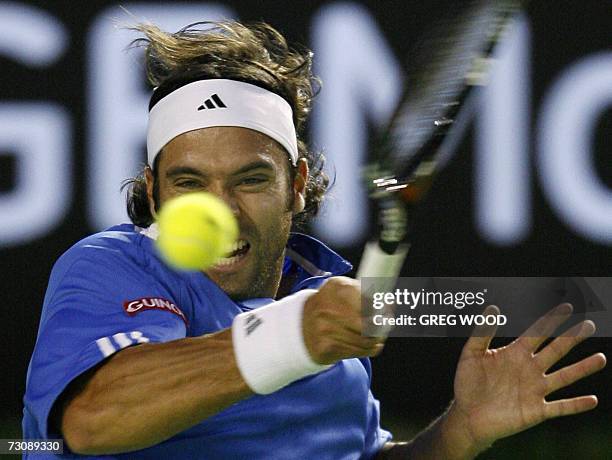 Fernando Gonzalez of Chile plays a shot during his quarter-final men's singles match against Rafael Nadal of Spain at the Australian Open tennis...