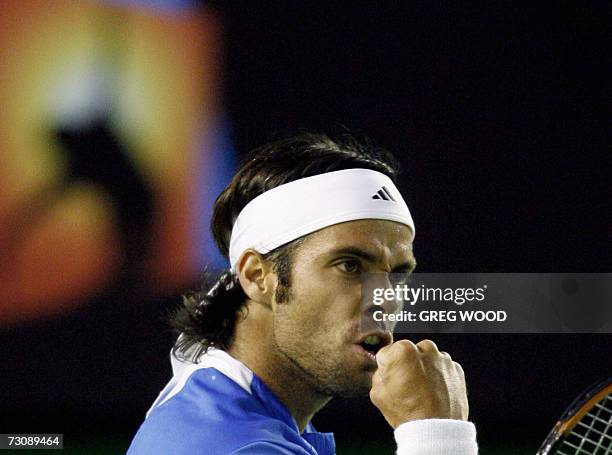 Fernando Gonzalez of Chile gestures as he celebrates winning a point during his quarter-final men's singles match against Rafael Nadal of Spain at...