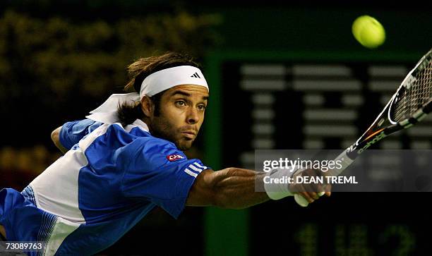 Fernando Gonzalez of Chile plays a shot during his quarter-final men's singles match againstRafael Nadal of Spain at the Australian Open tennis...