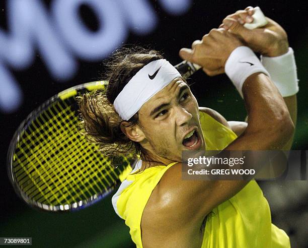 Rafael Nadal of Spain hits a return against Fernando Gonzalez of Chile in their men's singles quarter-final match at the Australian Open tennis...