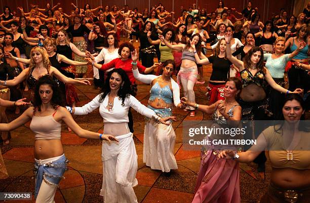 Israeli women take part in a Bellydance workshop, during the Eilat Festival of Oriental Dance, 20 January 2007, at the Israeli resort city of Eilat....