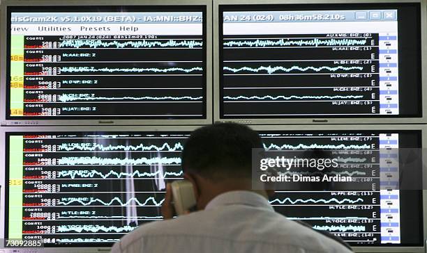 Meteorology and Geophysics Agency officer monitors a screen graphic at the BMG office of a 6.5-magnitude earthquake that struck North Sulawesi...