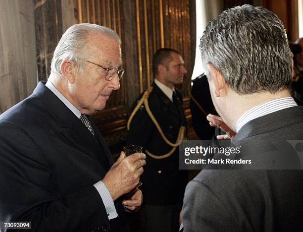 King Albert II of Belgium and Belgian Foreign Affairs Minister Karel De Gucht attend a reception at the Royal Palace, on January 24 , 2007 in...