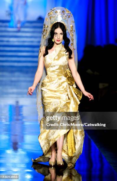 Burlesque artist Dita Von Teese walks down the catwalk during the Jean-Paul Gaultier fashion show as part of Spring / Summer 2007 Haute Couture on...