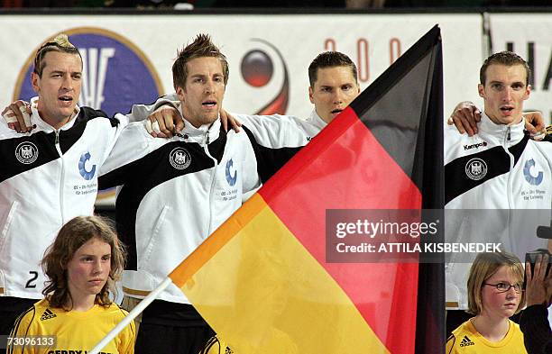 Germany's teammates sing the national anthem prior their main round Group I match against Slovenia of the 2007 men's Handball World Championship, 24...