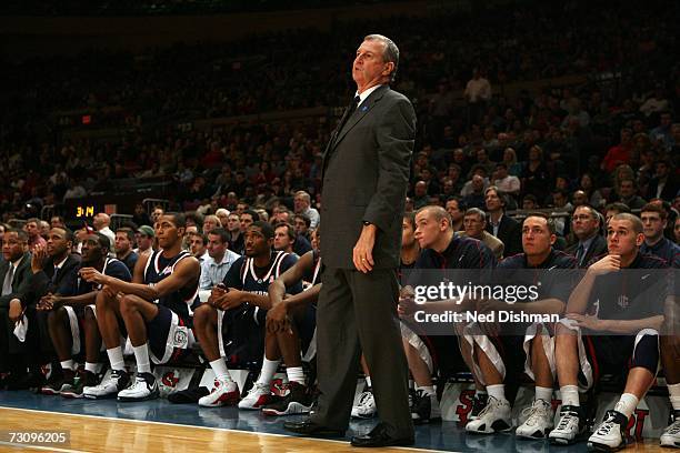 Head coach Jim Calhoun of the University of Connecticut Huskies looks toward the court by the bench against the St. John's University Red Storm at...