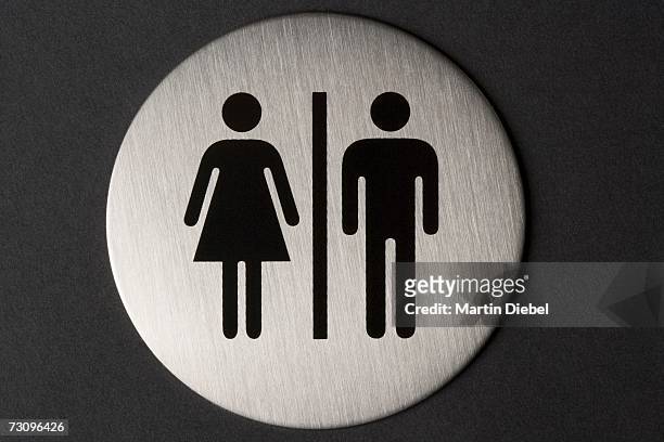 female and male sign on toilet door - objeto masculino fotografías e imágenes de stock