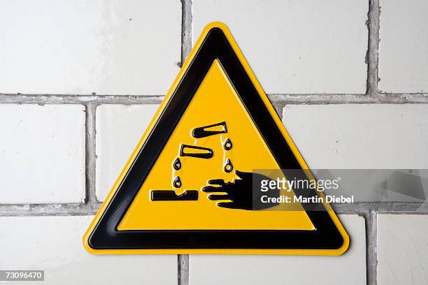 ?corrosive? warning sign - corrosive stock pictures, royalty-free photos & images