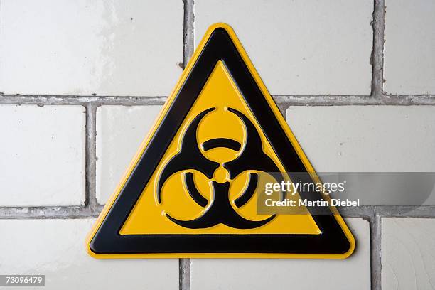 biohazard warning sign - biohazard symbol stockfoto's en -beelden