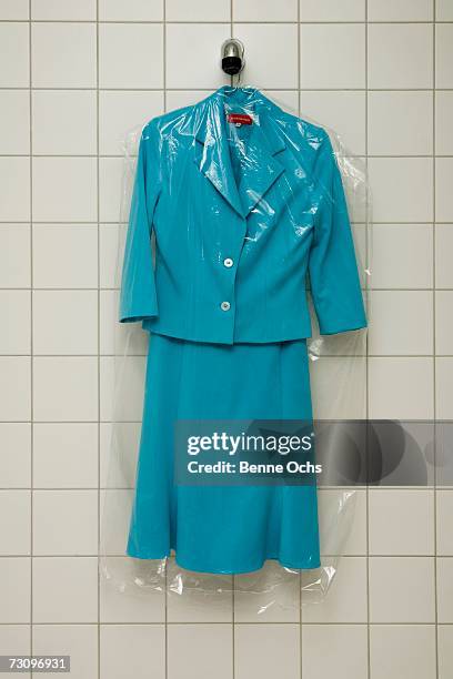 dry cleaned suit hanging in a shower - coathanger foto e immagini stock