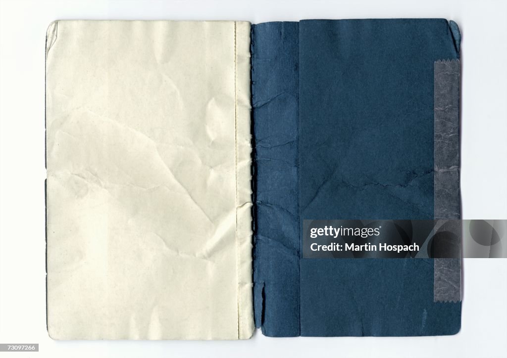 Inside the back of a weathered notebook