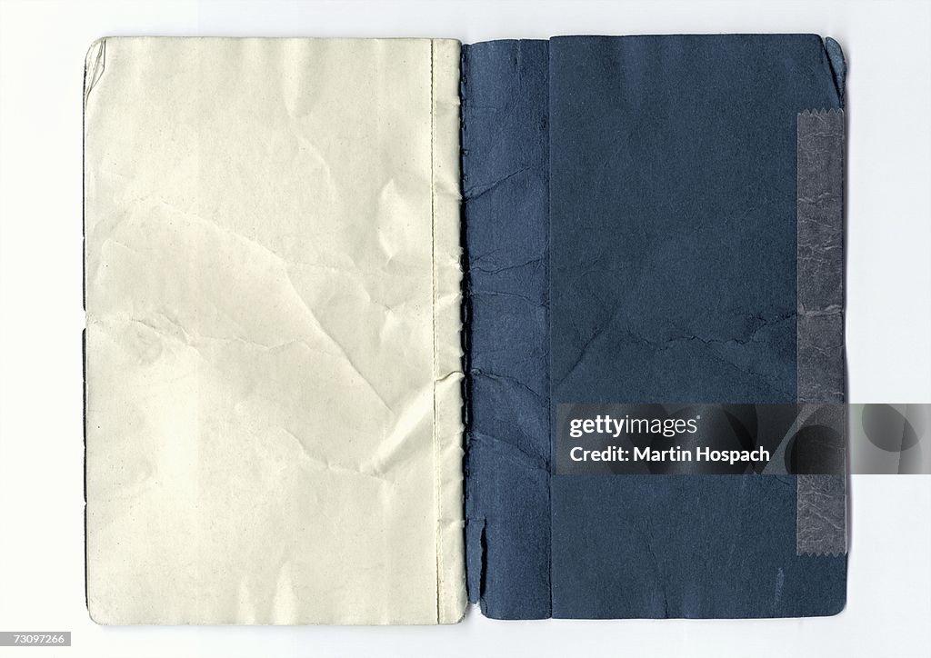 Inside the back of a weathered notebook