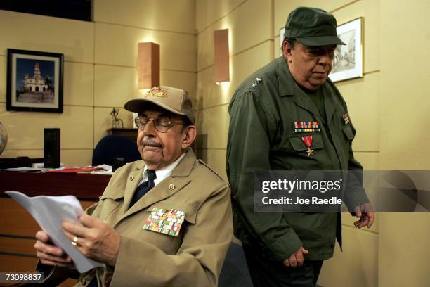 Armando Roblan who plays the character of Cuba?s Acting President Raul Castro and Manolo Coego who plays the character of "Yeyito" prepare for the...