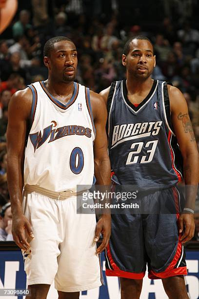 Gilbert Arenas of the Washington Wizards stand next to his teammate Derek Anderson of the Charlotte Bobcats on December 27, 2006 at the Charlotte...