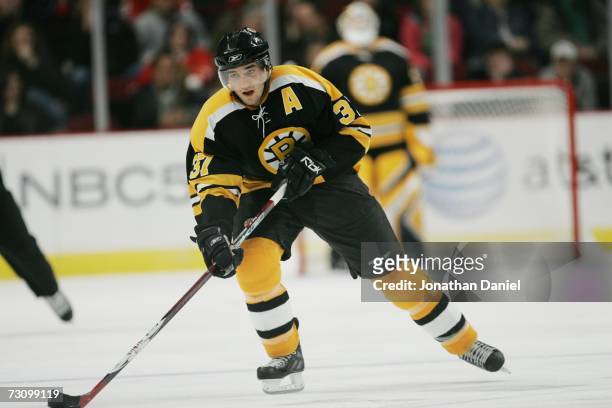 Patrice Bergeron of the Boston Bruins skates against the Chicago Blackhawks on December 29, 2006 at the United Center in Chicago, Illinois. The...