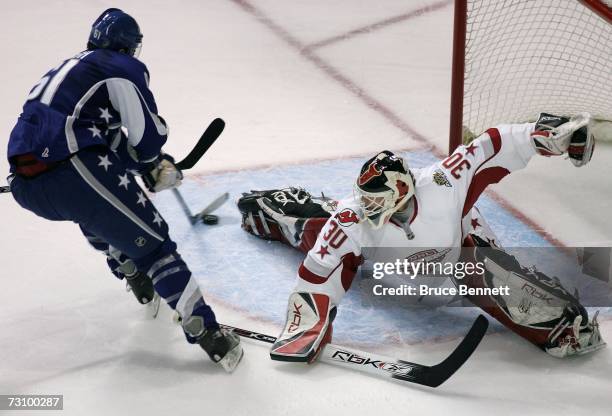 Eastern Conference All-Star goaltender Martin Brodeur of the New Jersey Devils allows a goal on the shot from Western Conference All-Star Rick Nash...