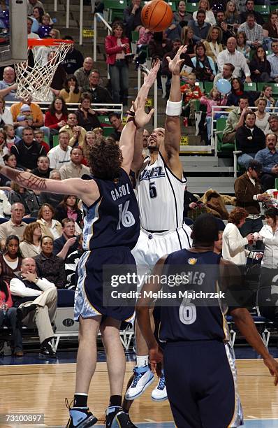 Carlos Boozer of the Utah Jazz goes up for a shot against Pau Gasol of the Memphis Grizzlies in NBA action January 24, 2007 at the EnergySolutions...