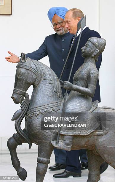 Russian President Vladimir Putin is welcomed by Indian Prime Minister Manmohan Singh prior a meeting in New Delhi, 25 January 2007. Putin arrived in...