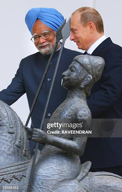 Russian President Vladimir Putin is welcomed by Indian Prime Minister Manmohan Singh prior to a meeting in New Delhi, 25 January 2007. Putin arrived...