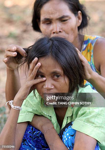 Rochom Soy , would-be mother of a Cambodian missing girl Rochom P'ngieng, takes care of her at Oyadao district in Rottanakiri province, some 610...