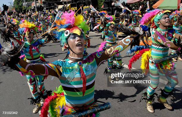 Performers dancing in the street during the culmination of the nine-day religious festival called Sinulog, in Cebu city, 21 January 2007. Sinulog is...