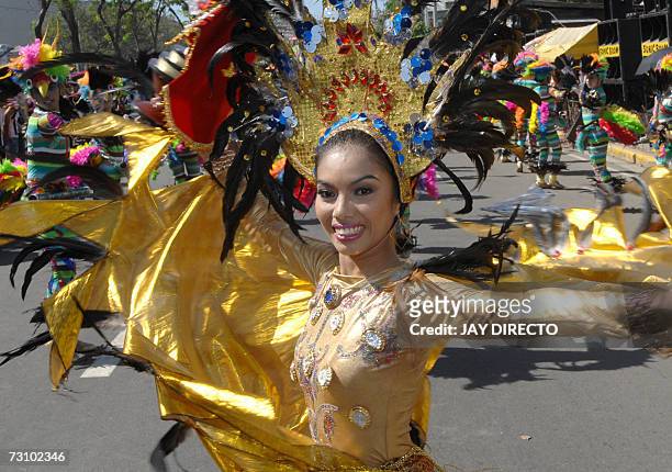Performers dancing in the street during the culmination of the nine-day religious festival called Sinulog, in Cebu city, 21 January 2007. Sinulog is...