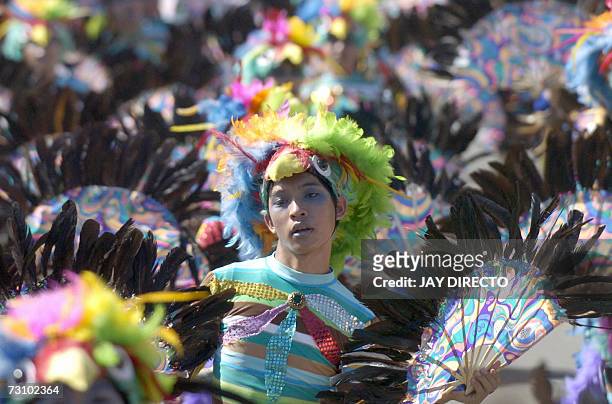 Performers dancing in the street, during the culmination of the nine-day religious festival called Sinulog, in Cebu city, 21 January 2007. Sinulog is...