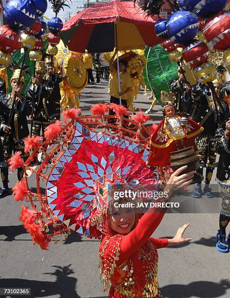 Performers dancing in the street, during the culmination of the nine-day religious festival called Sinulog, in Cebu city, 21 January 2007. Sinulog is...