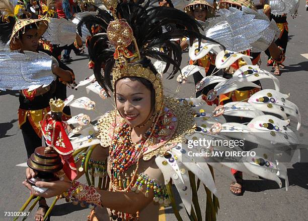 Performers dance in the street during the culmination of the nine-day religious festival called Sinulog, in Cebu city central Philippines 21 January...