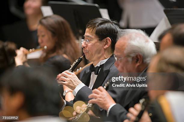 oboes player in symphony orchestra musicians during performance - soloist stock-fotos und bilder