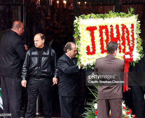 Floral arrangement with the name John spelled in flowers is placed in front of the Papavero funeral home for the wake of the late mobster John Gotti,...