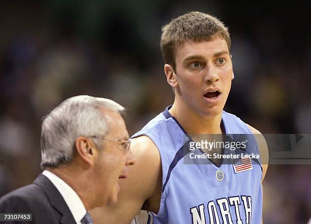 Head coach Roy Williams of the University of North Carolina Tar Heels coaches Tyler Hansbrough during the game against the Wake Forest Demon Deacons...