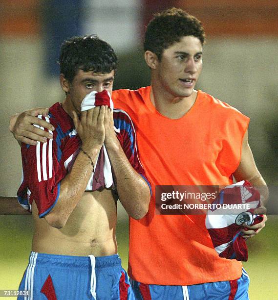Paraguay's Julian Benitez and teammate Juan Romero react at the end of the match against Brazil during their South American Under-20 championship...
