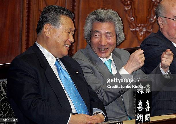 Former Japanese Prime Ministers Junichiro Koizumi and Yoshiro Mori talk prior to the start of the Lower House plenary session on January 26, 2007 in...
