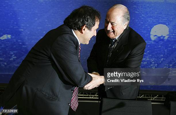 Former French football star Michel Platini shakes hands with FIFA President Sepp Blatter during the second day of the 2007 UEFA Congress at the...