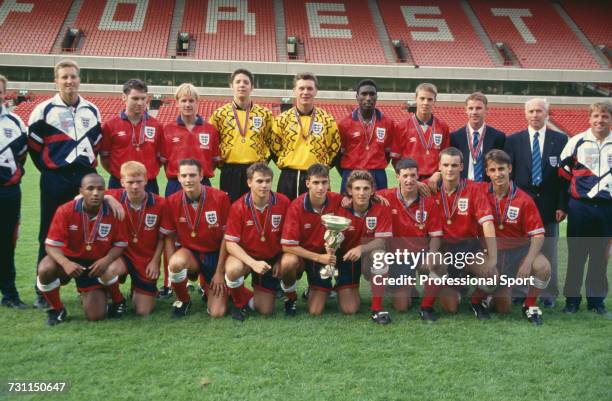 View of the victorious England under-18 team squad pictured posed together with the trophy after the England under-18 team won the 1993 UEFA European...