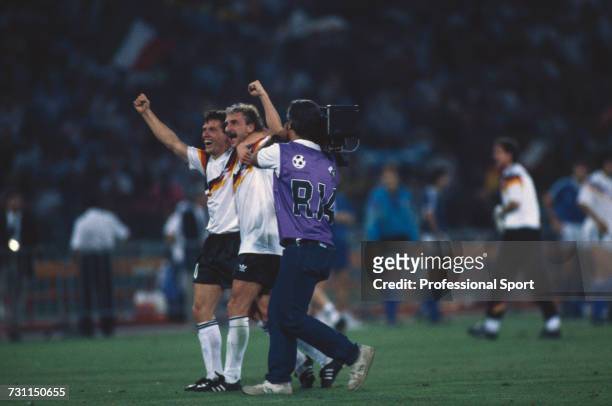 West German footballers Lothar Matthaus on left and Rudi Voller celebrate after West Germany beat Argentina 1-0 to win the 1990 FIFA World Cup Final...