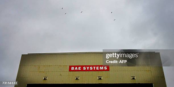 Barrow in Furness, UNITED KINGDOM: The BAE Systems construction hall dominates the skyline above the town of Barrow-in-Furness, north-west England,...