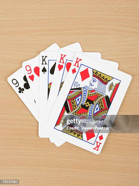 playing cards showing full house, close up - roi de carreau photos et images de collection