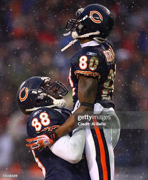 Desmond Clark and Bernard Berrian of the Chicago Bears celebrate Berrian's 33-yard touchdown reception in the fourth quarter against the New Orleans...