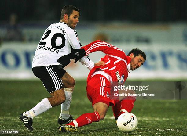 Michael Wiesinger of Burghausen is challenged by Fabrice Ehret of Cologne during the Second Bundesliga match between Wacker Burghausen and 1. FC...