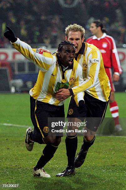 Tinga of Dortmund celebrates scoring the fives goal with team mate Florian Kringe during the Bundesliga match between Borussia Dortmund and Bayern...